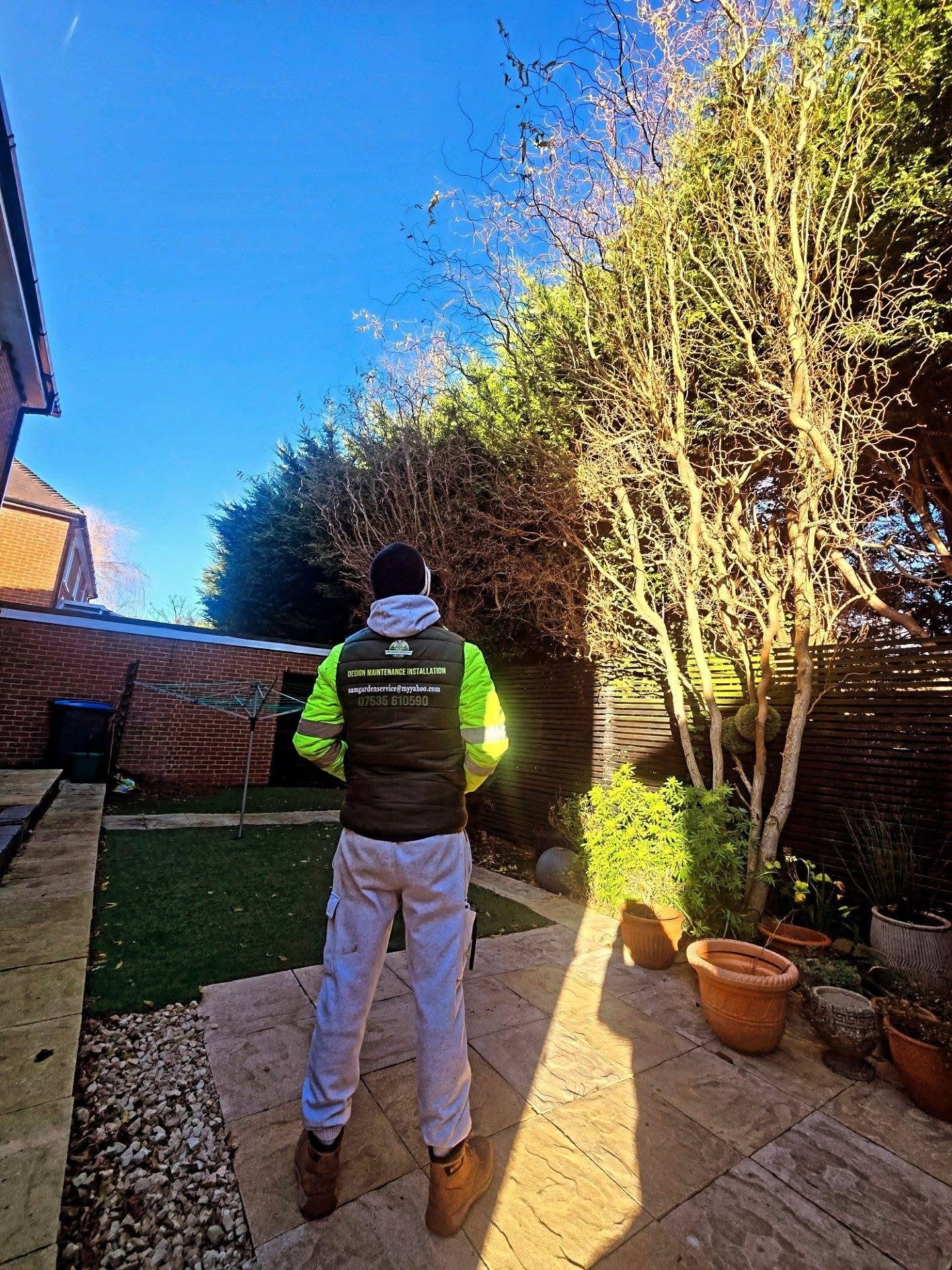 Sam's Garden Services team member on a completed patio and garden visit